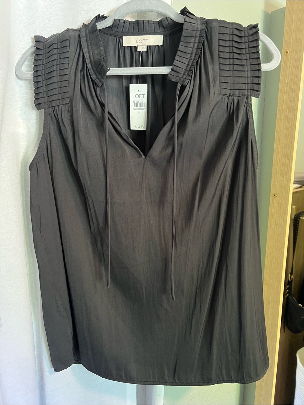 Loft sleeveless black blouse with tie neck- women’s medium